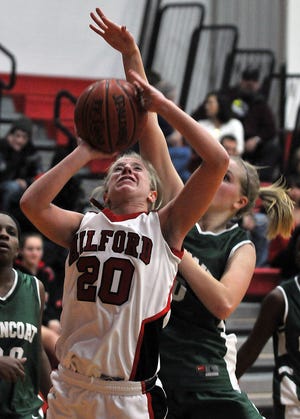 Milford's Katelyn O'Rourke grabs an offensive rebound on Friday night.