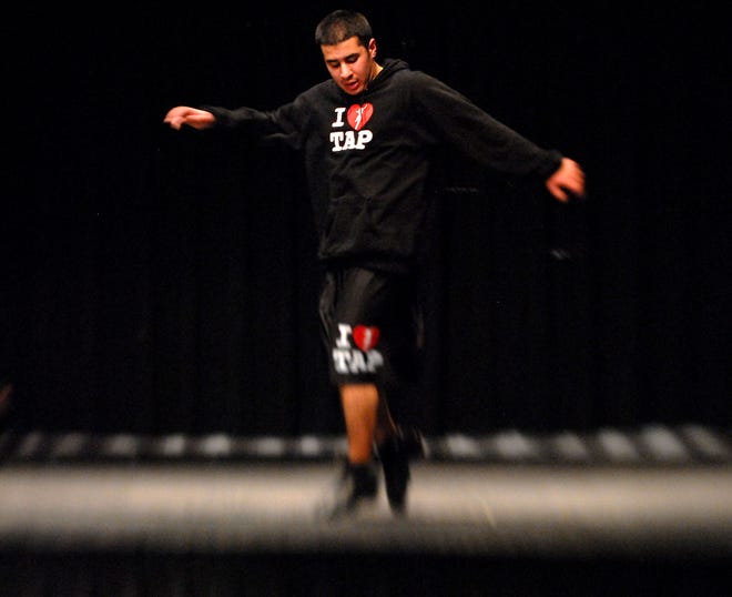 WOODSTOCK 1/22/2009
Dan Mitra, a senior at Woodstock Academy, tap dances on the school's stage Thursday, January 22, 2009. Mitra's dance talents were recognized recently by the National Foundation for Advancement in the Arts .
Tali Greener/Norwich Bulletin