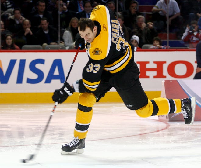 Bruins defenseman Zdeno Chara takes a shot during his victory in the hardest shot competition on Saturday night.