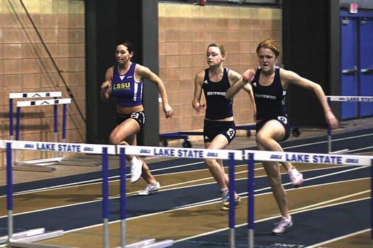 Taylor Patton, left, trails in the 55-meter hurdles against two Northwood runners at a dual meet at the Norris Center SAC on Saturday.