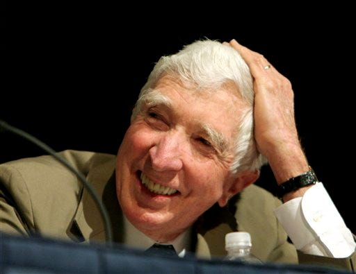 In this May 20, 2006 file photo, author John Updike takes part in a panel discussion at BookExpo America 2006 in Washington. Updike, the Pulitzer Prize-winning novelist, prolific man of letters and erudite chronicler of sex, divorce and other adventures in the postwar prime of the American empire, died today of lung cancer, according to a statement from his publisher, Alfred A. Knopf. He was 76.