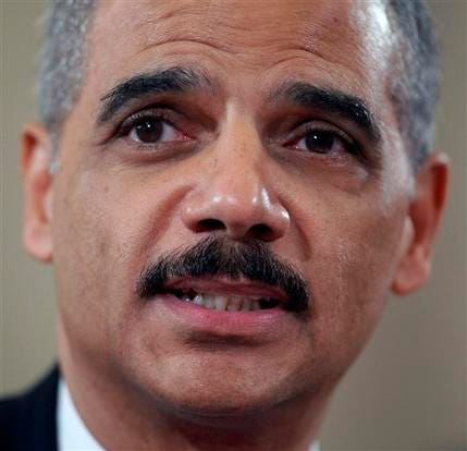 In this Jan. 15, 2009 file photo, Attorney General-designate Eric Holder testifies on Capitol Hill in Washington before the Senate Judiciary Committee hearing on his nomination.