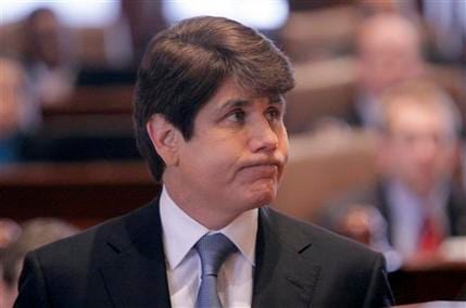 Illinois Gov. Rod Blagojevich looks up at Illinois Supreme Court Chief Justice Thomas Fitzgerald before delivering his closing argument at his impeachment trial today in Springfield, Ill. The senate voted unanimously to convict Blagojevich and throw him out of office.