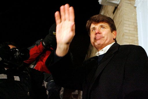 Former Illinois Gov. Rod Blagojevich waves to his supporters after talking to the media outside of his Chicago home, Thursday, Jan. 29, 2009. Blagojevich was thrown out of office Thursday without a single lawmaker rising in his defense, ending a nearly two-month crisis that erupted with his arrest on charges he tried to sell Barack Obama's vacant Senate seat. Blagojevich becomes the first U.S. governor in more than 20 years to be removed by impeachment. (AP Photo/Nam Y. Huh)