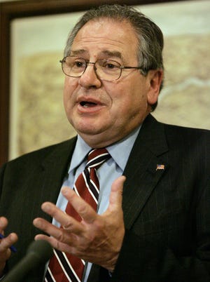 House Ways and Means Committee Chairman Robert DeLeo, D-Winthrop, talks to reporters at the unveiling of a Democratic state budget proposal at the Statehouse in Boston. DeLeo is expected to be one of the contenders for the House Speaker's seat after Salvatore DiMasi said that he was resigning.