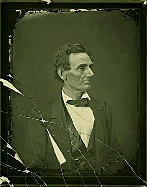 This image released by George Eastman House is a conserved broken glass-plate interpositive of Abraham Lincoln, taken by Alexander Hesler at the Illinois state Capitol in Springfield on June 3, 1860. George Eastman House International Museum of Photography & Film conserved the glass-plate interpositive, which was used to make copy prints following Lincoln's death. The interpositive is owned by an anonymous collector. (AP Photo/Courtesy George Eastman House)