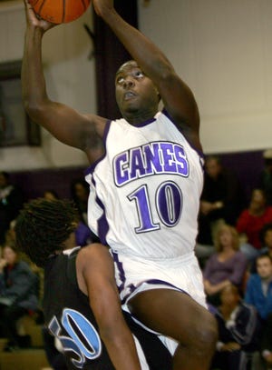 Gainesville’s Anthony Nwadigo shoots against a P.K. Yonge defender on Tuesday.