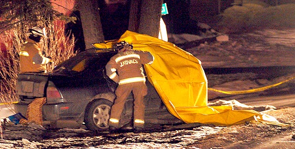 Stroud Township firefighters tend to the scene of a one-car fatal accident in Stroud Township on Wednesday night.