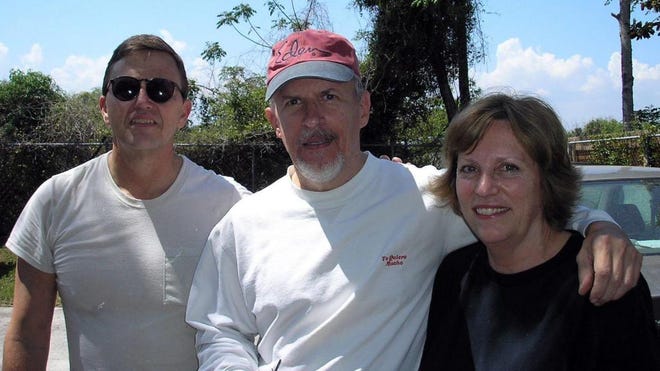Volunteers Michael (left) and Yvonne Appell are pictured with Hart Felt Ministries client Malcolm Luckin.