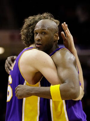 ASSOCIATED PRESS / AMY SANCETTA
How 'bout a hug
Los Angeles Lakers' Lamar Odom, right, is congratulated by teammate Pau 
Gasol after the Lakers beat the Cleveland Cavaliers 101-91 Sunday in 
Cleveland. Odom scored 28 points.