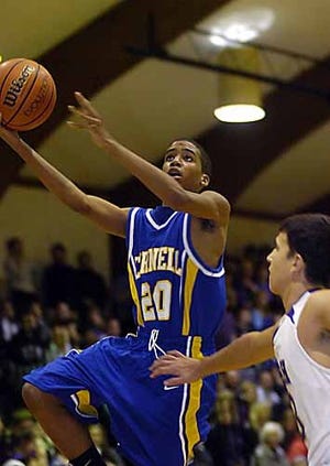 Times file photo by SYLVESTER WASHINGTON JR. NICE RING TO IT: Cornell’s Davon Brooks drives to the basket against OLSH. On Friday, Brooks and the Raiders will be driving to Ringgold to take on Carmichaels.