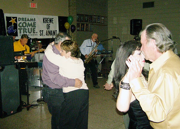 Couples dance to the music of Kenny Fife during the first Krewe of St. Amant Ball Friday night at the Gonzales Knights of Columbus. The 6th annual Krewe of St. Amant Mardi Gras Boat Parade will be Saturday at 12:30 p.m. starting and ending at Canal Bank Club on the Diversion Canal. Proceeds go to the “Dreams Come True” organization, which provides dreams to area children with life-threatening illnesses.