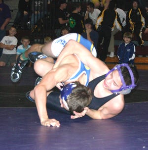 Dutchtown’s Dallas Chenevert attempts to takedown East Ascension’s Braden Sonnier in Chenevert 11-9 decision at the Jambalaya Cup Friday night.