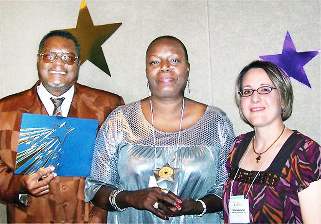 DeVoria Gaines-Ruffin, center, the 2008 Bill and Carol Krueger Adult Learner of the Year, with her husband Jimmy Ruffin and her instructor Shannon Carter, when she received the award in Norman in 2008. Provided by Oklahoma Department of Libraries