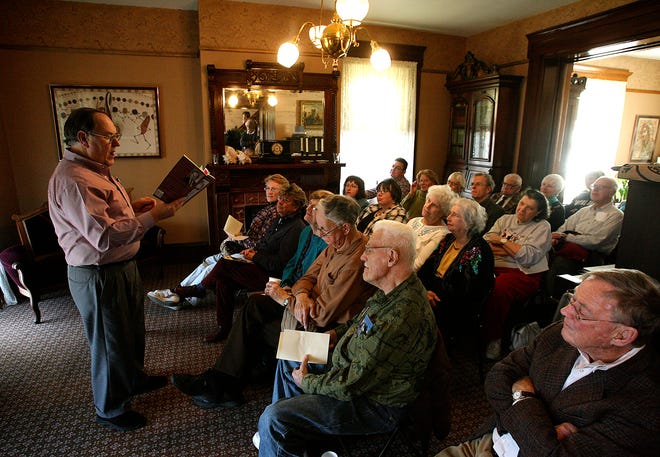 Poet and writer Dan Guillory reads some of his work about Abraham Lincoln on Tuesday at the Vachel Lindsay Home. Tuesday's program commemorated the anniversary of the Lincoln Reception held the evening before Lincoln left for Washington.