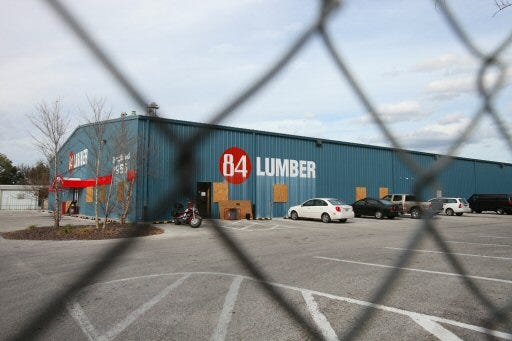 The 84 Lumber store on Northwest 27th Avenue in Ocala is shown boarded up through a locked fence on Wednesday.
