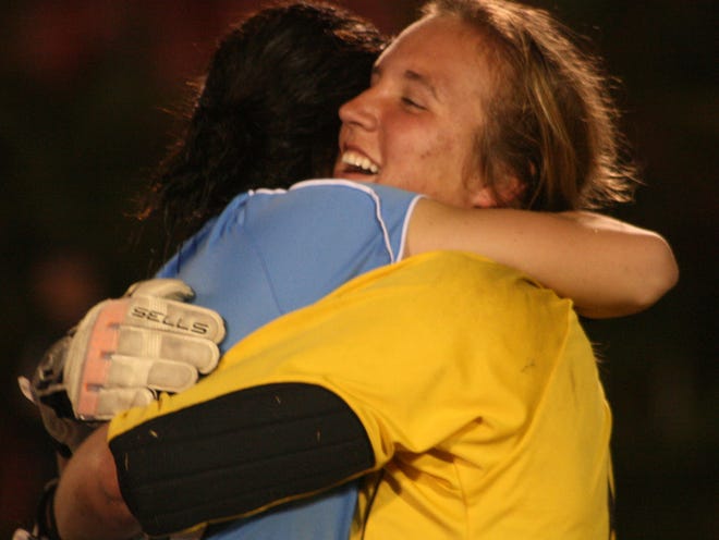 RANDY LEFKO/The Times-UnionSt. Johns goalie Sarah Voight gets a hug from teammate Carson Pickett after the win.