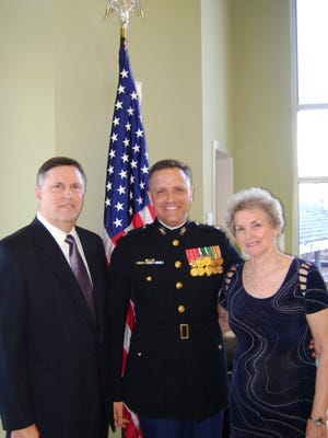 U.S. Marine Corps Lt. Col. Scott Ballard recently celebrated retirement after 25 years in the corps. Ballard, a graduate of Hickman High School and the University of Missouri, now resides in Gainesville, GA., with his wife, Rhonda, and their four children. Here, Ballard enjoys a moment with his parents, Dennis and Rita Ballard of Sturgeon.