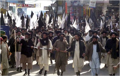 Supporters of Maulana Sufi Muhammad, a hard-line Islamic cleric, marched Wednesday in Mingora, Pakistan, to back a truce in the Swat Valley between the government and the Taliban.