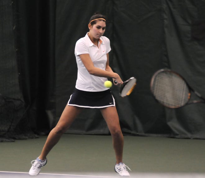 Hope's Lucy Hines returns a serve against Wheaton Saturday at the DeWitt Tennis Center.