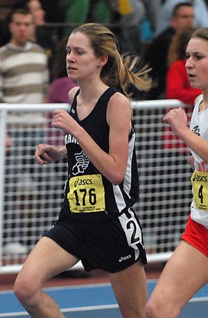 Franklin's Mary Cole runs the mile during the Div. 2 state championships at the Reggie Lewis Center.