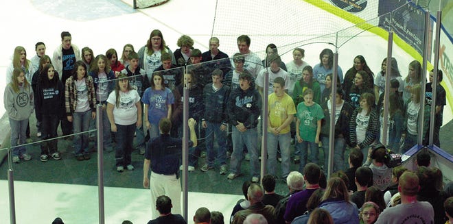 Under the direction of Jason Strough, Prairie Central High School’s choir performed the national anthem at the Bloomington PrairieThunder hockey game Saturday. It was Fairbury Night with a group from the community in attendance. The PCHS pep band also performed during breaks and between periods.