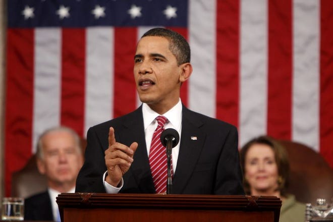 President Barack Obama addresses a joint session of Congress in the House Chamber of the Capitol in Washington , Tuesday, Feb. 24, 2009. Vice President Joe Biden and House Speaker Nancy Pelosi of Calif. are behind the president.