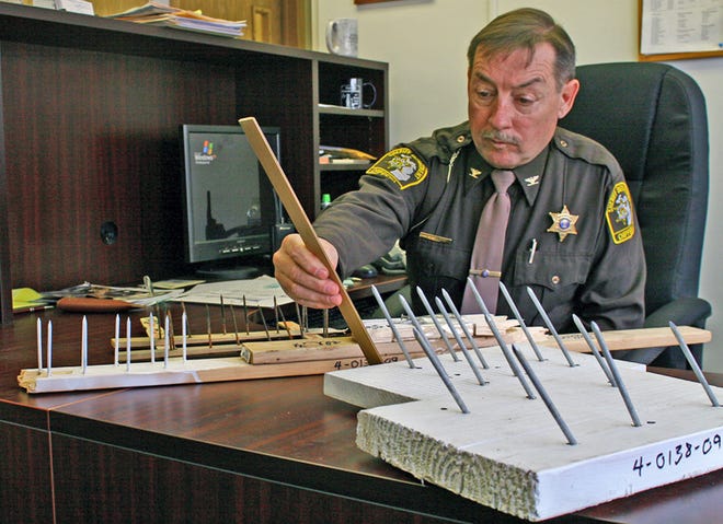 Undersheriff Robert Savoie of the Chippewa County Sheriff Department displayed a series of makeshift spike strips that have been placed at random locations throughout the M-123 corridor. Savoie expressed the belief that there may be other spike strips throughout the area that have been pushed off the public roadways by passing plow trucks which will only be revealed when the snow melts off the frozen landscape.