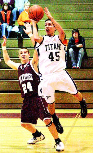 Monmouth-Roseville's Alex Bresnahan shoots around Rockridge's Jeremy McManus, and is fouled, sending Bresnahan to the line with seconds remaining and the score tied. Bresnahan made two free throws and the Titans won the game 36-35. Saved to Thursday folder in ATS. by Kriegshauser. 2/25/09