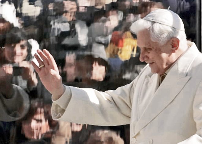 Pope Benedict XVI gestures during the weekly general audience in St. Peter’s Square. The Vatican is holding conferences dedicated to the works of Charles Darwin and Galileo Galilei. AP PHOTO