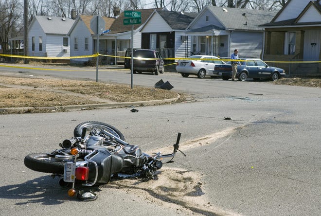 A Honda motorcycle lays crumpled at the intersection of 15th Street and Moffat Street after colliding with a Dodge minivan in an accident on Wednesday, Feb. 25, 2009, in Springfield Ill. The driver of the motorcycle suffered life-threatening injuries.