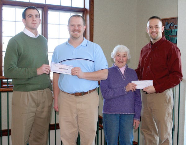 Country Bank presents $8,000 to local organizations. Pictured left to right: Brett Lee, Country Bank construction and development operations; Rusty Ruggles, Central Park Band Shell; Jo Lawson, Churches of Mercer County Food Pantry and Andy Frye, Country Bank assistant vice president construction and development officer.