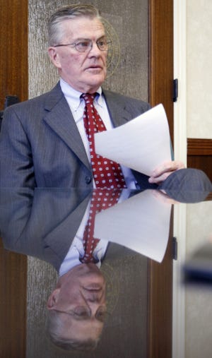 Mayor Bill Bunten holds a list of the books the library board decided to restrict during a meeting in his office at City Hall. Bunten appoints some members of the library board