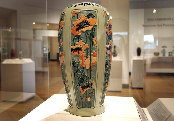 Asian-inspired orange floral accents reflects pottery from one of Roseville’s most successful lines: Della Robbia. The style was an intricate pattern produced by carving the decoration into moist clay and cutting away the background to reveal the underlying color.