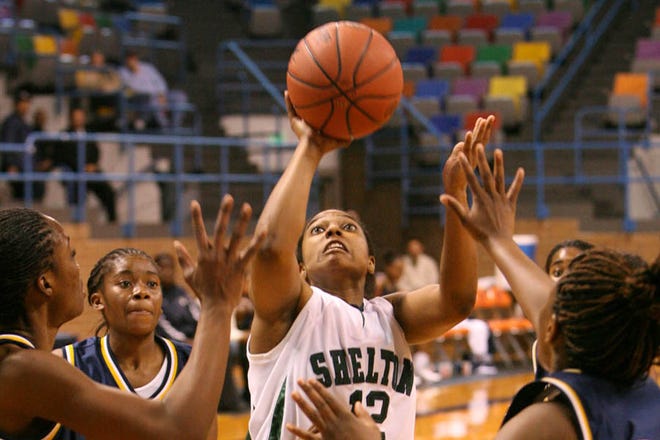 03-03-09 -- Hanceville, Ala -- Shelton State's China Antoine shoots in the final minutes of the women's basketball quarterfinal match against Lawson State in the Alabama Community College Tournament at Wallace State Community College in Hanceville, Al March 3, 2009.  (Dan Lopez/ The Tuscaloosa News)