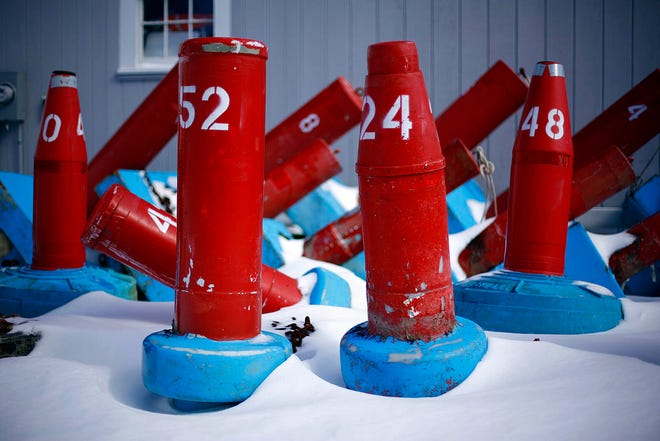 Channel buoys sit in the snow behind the Kingston harbormaster’s office on River Street. The recent snow and dead-of-winter cold have made the boating season seem far off, but the forecasters say we can expect temperatures in the 50s this weekend.