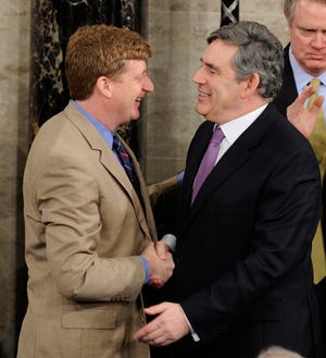 British Prime Minister Gordon Brown shakes hands with Rep. Patrick Kennedy, D-R.I., on Capitol Hill in Washington, Wednesday after Brown announced that Kennedy's father, Sen. Ted Kennedy, D-Mass., will receive an honorary knighthood, during Brown's address to a joint session of Congress in Washington.