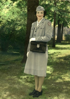 Jeannette Lloyd, dressed in a formal uniform, served as a Red Cross recreation director for American troops overseas during World War II. 
Jeannette Lloyd, dressed in a formal uniform, served as a Red Cross recreation director for American troops overseas during World War II.