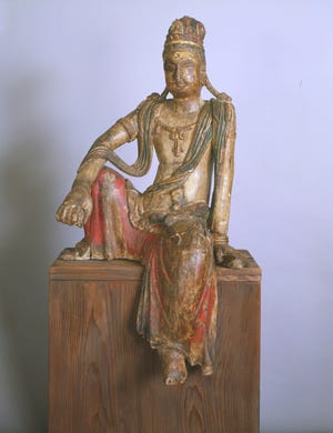 Guanyin, Chinese 11th to 12th century, wood, with remains of color and gilding.