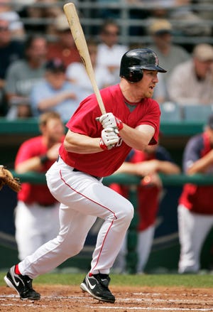J.D. Drew watches the flight of his ball as he singles off Marlins' pitchder Chris Volstad in the first inning of the Red Sox' 5-3 victory in an exhibition game on Friday in Fort Myers, Fla.