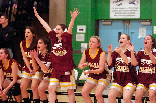 Players on the Cardinal Spellman bench celebrate late in their win over Bourne on Thursday night.