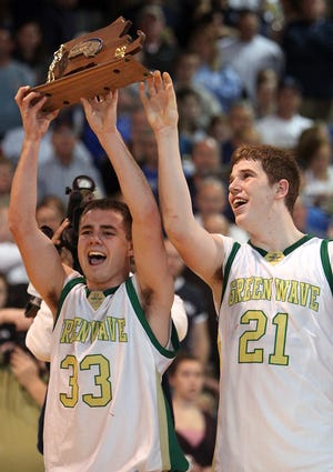 Abington's Kristian LaPointe and Chris Tighe show off the Div. 3 South Sectional trophy after the Green Wave's 80-69 victory over Scituate on Saturday afternoon.