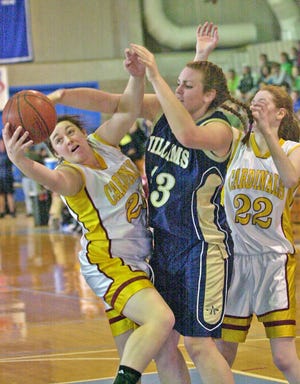 Alison Ezipek (Spell), Valerie Driscoll (AW) and Molly Anderson (Spell) fight for possession of the ball during the Division 3 South Sectional girls basketball final between Cardinal Spellman and Archbishop Williams at UMass/Boston.