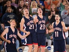 CHIEFTAIN PHOTO/BRYAN KELSEN — CSU-Pueblo women's basketball players (from left) Shandryn Trumble, Mary Rehfeld, Amanda Bartlett and Jonnie Draper celebrate in the waining moments of their RMAC Shootout championship Saturday at the Colorado State Fair Events Center. The Thunderwolves beat Colorado Mines 62-42 to win the title for the second year in a row.