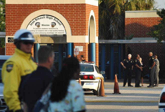 JON M. FLETCHER/The Times-UnionPolice have locked down Ribault High School where, according to a Jacksonville Sheriff's Office spokesman, several students involved in a Tuesday morning altercation fired shots at each other before school.