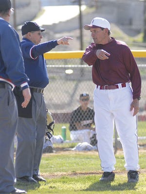 Barstow’s head coach Bruce Mitchell argues a called foul ball with the home plate umpire during the Aztecs home opener against Rubidoux Tuesday afternoon.
