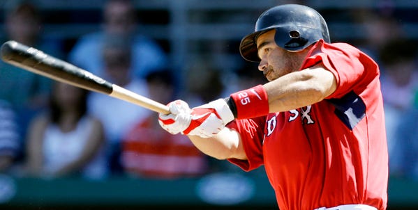 Mike Lowell of the Red Sox connects for a single against the Baltimore Orioles on Tuesday. Lowell, recovering from offseason hip surgery, went 1-for-3 as a designated hitter in his spring debut.