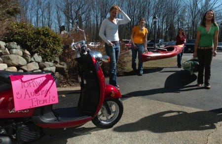 From left, Lauren Blackburn, Kristen Raymond, Miriam Stevens and Karin Sweeney transport items that will be auctioned during Yorkwise, an annual auction that raises funds for alcohol and chemical-free events at the school.