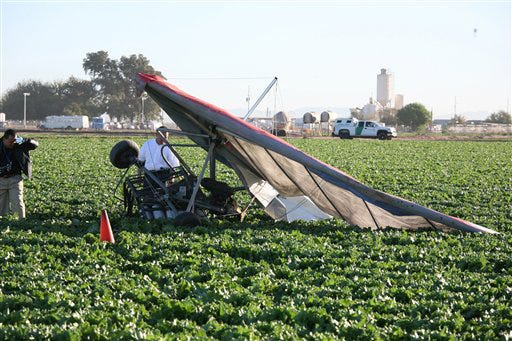 An ultralight aircraft which crashed in a lettuce field north of San Luis, Ariz., resulting in the pilot's death, is seen in this undated photo provided by the U.S. Border Patrol. Smugglers facing strengthened border defenses have been trying a new tactic to bring drugs into the country, using sometimes precariously overloaded ultralight aircraft to fly marijuana loads over agents, cameras and fences. Federal officials believe more such attempts are happening or will be before authorities can devise a way to prevent them, though there's no agreement on whether ultralight drug flights are a trend or a novelty.