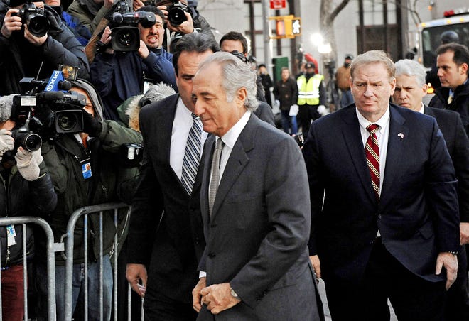 GO DIRECTLY TO JAIL Bernard Madoff arrives Thursday at federal court in Manhattan, where the discraced financier pleaded guilty to 11 charges related to a massive Ponzi scheme. Prosecuters say Madoff could be sentenced to up to 150 years in jail. It was, perhaps, the biggest swindle in Wall Street history and his victims applauded in the courtroom as he was led off to jail in handcuffs.